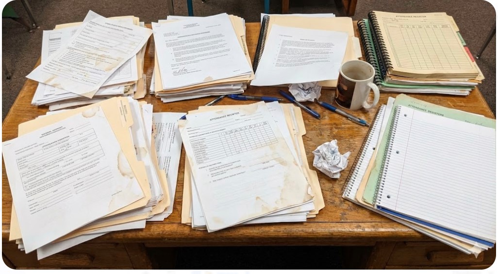 Messy stack of school paperwork